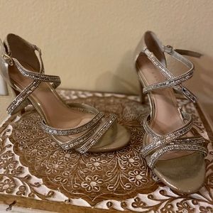 Strappy gold heels with crystal accents